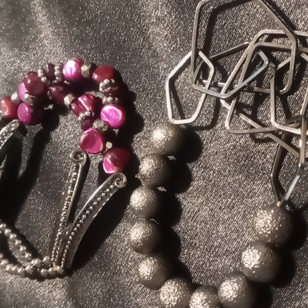 2 expandable bracelets beaded with blackened accents.